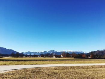 Scenic view of landscape against clear blue sky