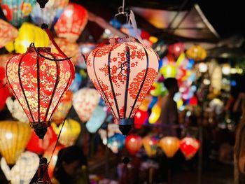 Illuminated lanterns hanging in market