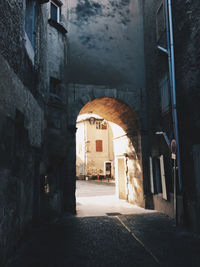 Narrow alley amidst buildings in city