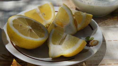 High angle view of fruits in plate on table