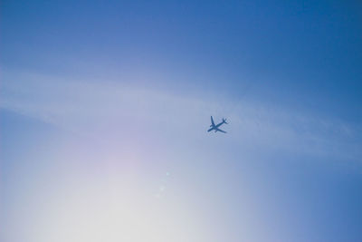 Low angle view of airplane flying in sky