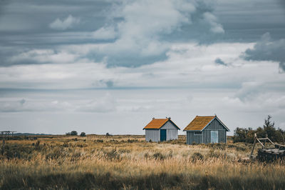 House on field against sky