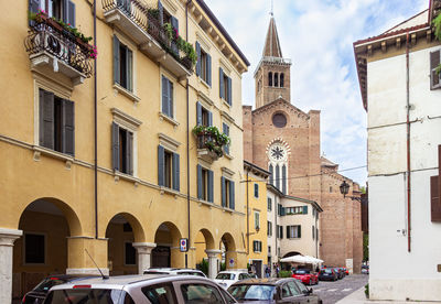 Cars on street amidst buildings in city