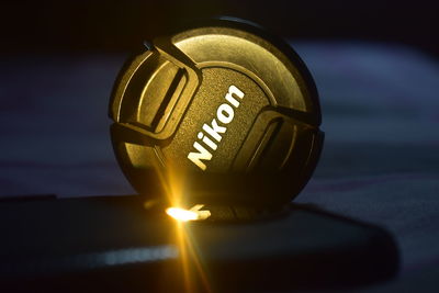 Close-up of electric lamp on table