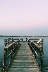 Pier over sea against sky