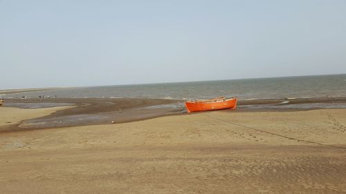 Scenic view of beach against clear sky