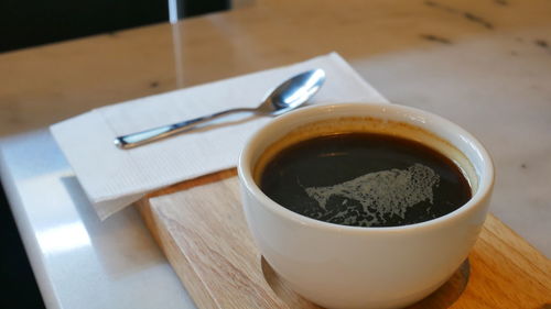 High angle view of coffee cup on table