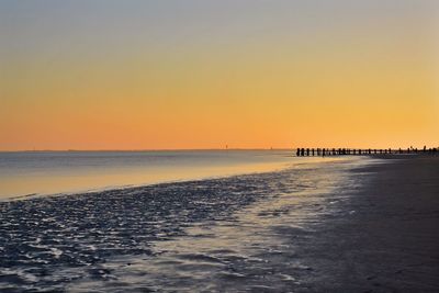 Scenic view of sea against clear sky during sunset