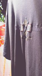 Close-up of clothes hanging on metal