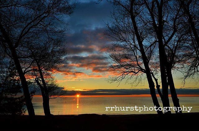 sunset, tree, tranquility, tranquil scene, silhouette, scenics, sky, beauty in nature, water, bare tree, nature, cloud - sky, lake, idyllic, branch, tree trunk, cloud, non-urban scene, orange color, outdoors