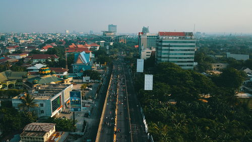 High angle view of buildings against clear sky