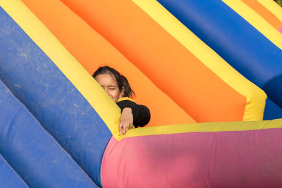 Portrait of a little girl sitting on inflatable ring