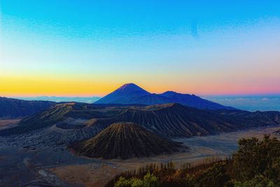 Scenic view of landscape against sky during sunset