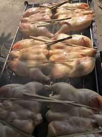 High angle view of meat on barbecue grill