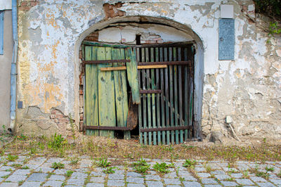 Abandoned wooden door of old house