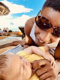 Cropped image of senior woman relaxing at beach