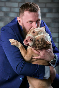 Portrait of man with dog