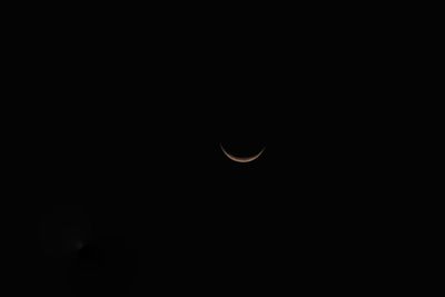 Low angle view of moon against sky at night