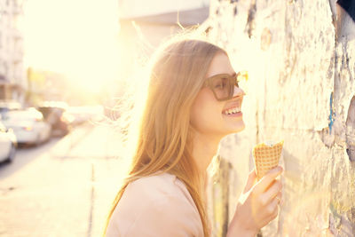 Portrait of smiling woman with ice cream