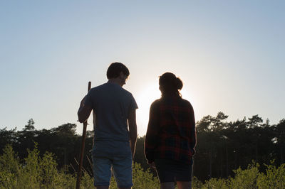 Rear view of couple against sky