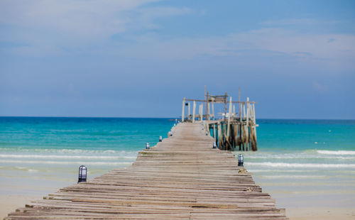 Pier over sea against sky