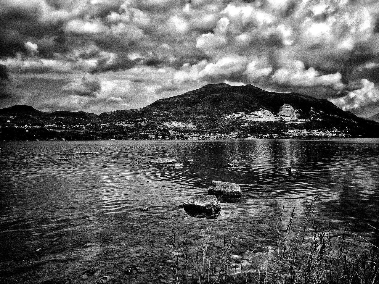 SCENIC VIEW OF LAKE AGAINST MOUNTAIN