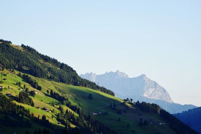 Scenic view of mountains against clear blue sky