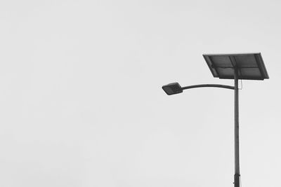 Low angle view of street light against clear sky