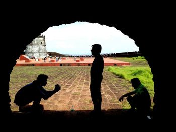 Silhouette of children playing soccer