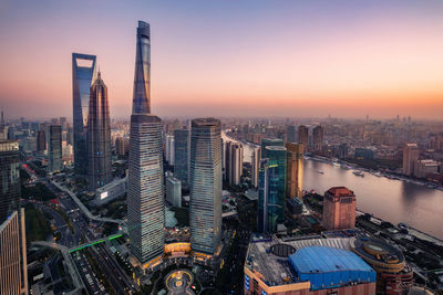 High angle view of city buildings during sunset