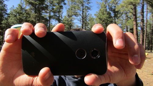 Close-up of person photographing with mobile phone