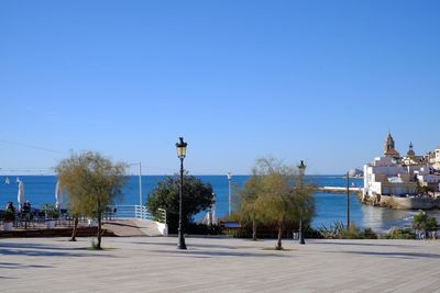 Scenic view of sea against clear blue sky