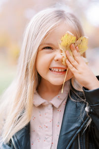 Young woman holding flower