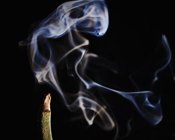 Close-up of smoke against black background