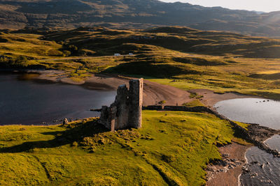 View of the ruined ardvreck castle over loch assynt, sutherland, north west highlands, scotland