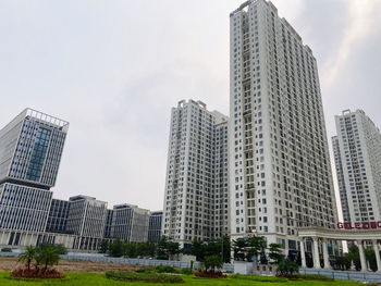 Modern buildings in city against sky