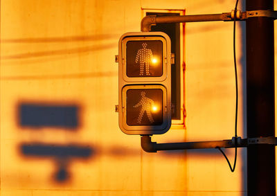 Close-up of road signal with sunlight in the morning
