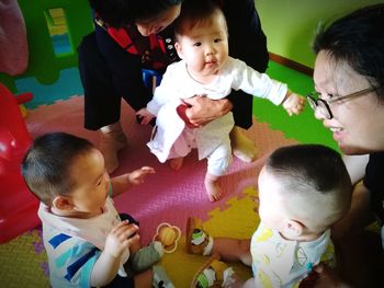 High angle view of father and daughter playing