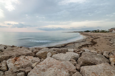 Scenic view of sea against cloudy sky