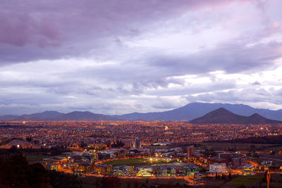 High angle view of illuminated buildings in city against sky