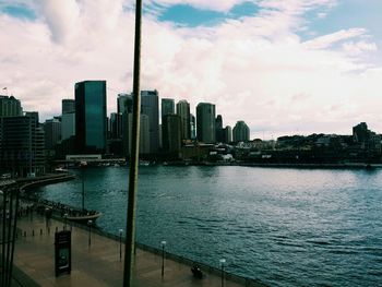 Cityscape against cloudy sky
