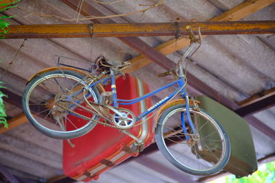 High angle view of bicycle parked by wall