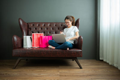 Man sitting on chair at home