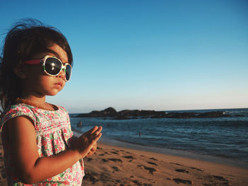 Portrait of girl standing on beach