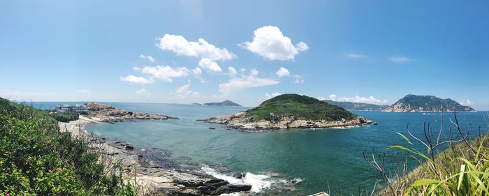 Panoramic view of bay against sky
