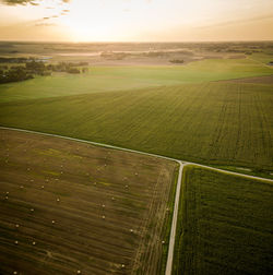Scenic view of field against sky during sunset