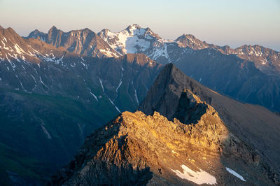 Panoramic view of snowcapped mountains against sky