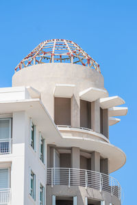 Rounded modern white under construction top building tower  from puerto rico san juan town