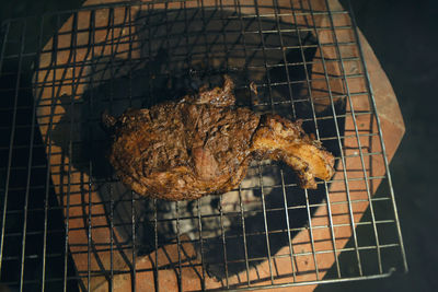 High angle view of meat on barbecue grill