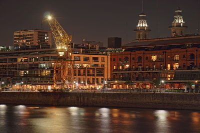 Illuminated buildings in city at night